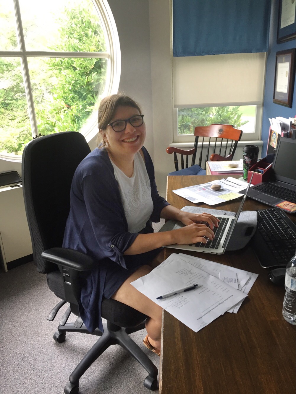 Julia Kaback sits at her desk in the Admission Office.