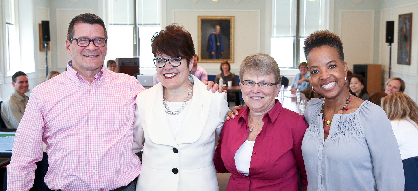 Photo of President Bergeron with Presidential Staff Award winners